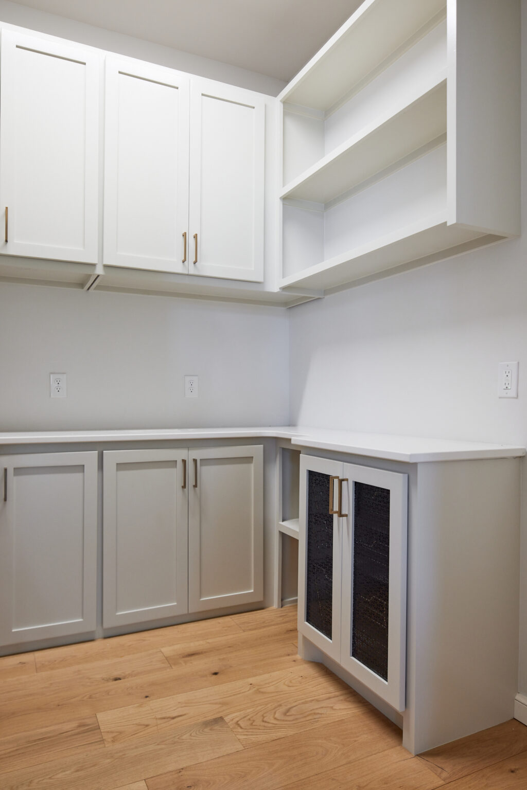 The kitchen with wooden shelf in white color at Norman, OK