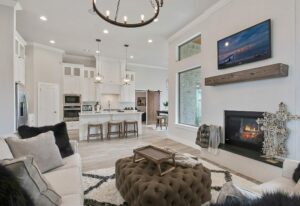 A luxurious living room with fire place inbuilt.