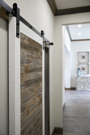 The sliding door with wooden finished from Land mark fine homes at Norman, OK