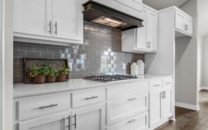 The kitchen with luxury chiminea from Landmark Fine Homes