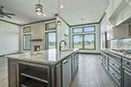 landmark home with granite countertops and dark grey cabinets