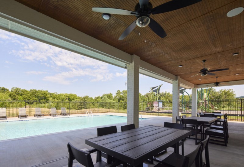 Patio area at The Landmark Fine Homes, featuring seating and greenery in Oklahoma City.