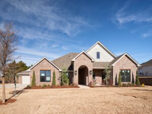 Residential brick home with a Drew floor plan and neat landscaping in the Oklahoma City metro area
