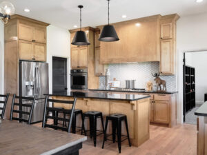 Warm wood kitchen with island seating and Hudson Floor Plan in the Oklahoma City metro area