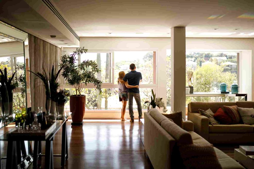 A man and woman standing in a room by a window, Oklahoma City Metro