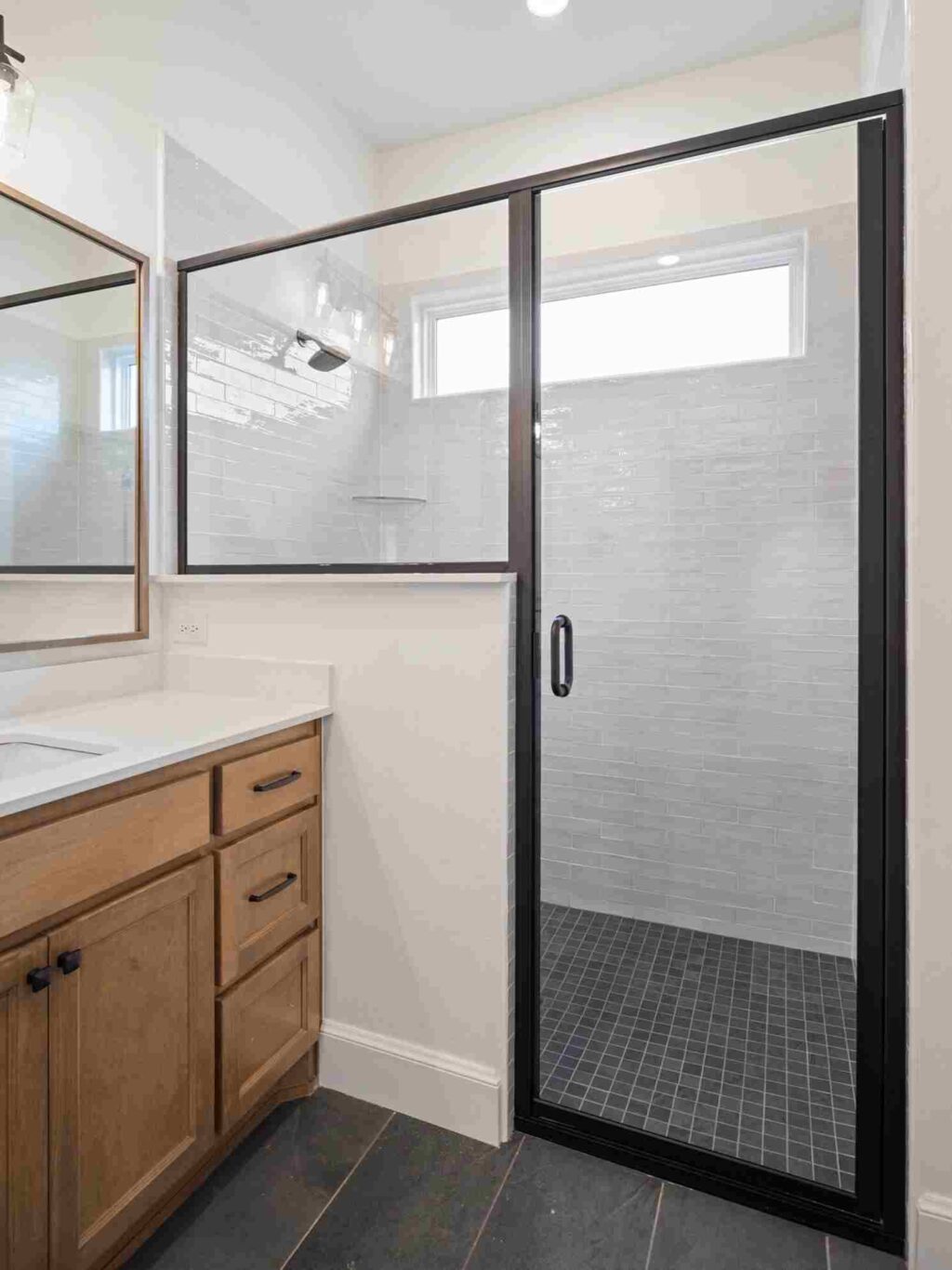 A well-lit bathroom in Oklahoma City, equipped with a shower and sink