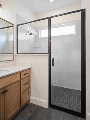 A well-lit bathroom in Oklahoma City, equipped with a shower and sink
