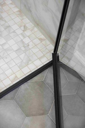 Modern shower featuring a glass door and tile flooring, situated in Oklahoma City