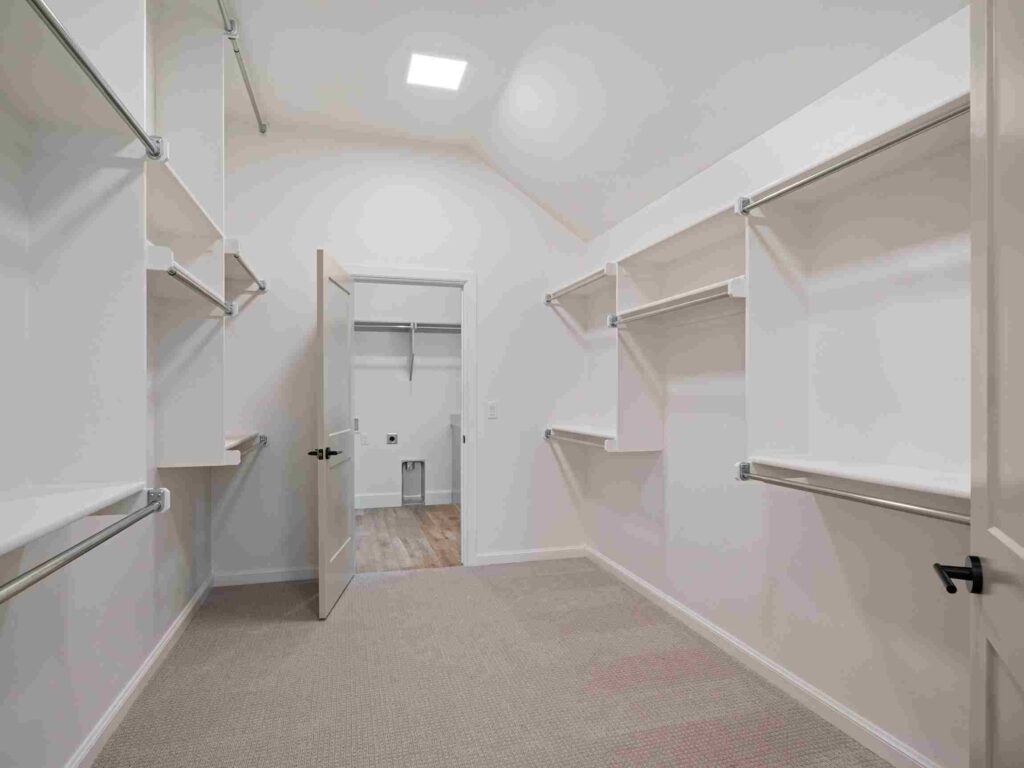 A walk-in closet in Oklahoma City displaying shelves and open shelving