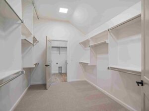 A walk-in closet in Oklahoma City displaying shelves and open shelving