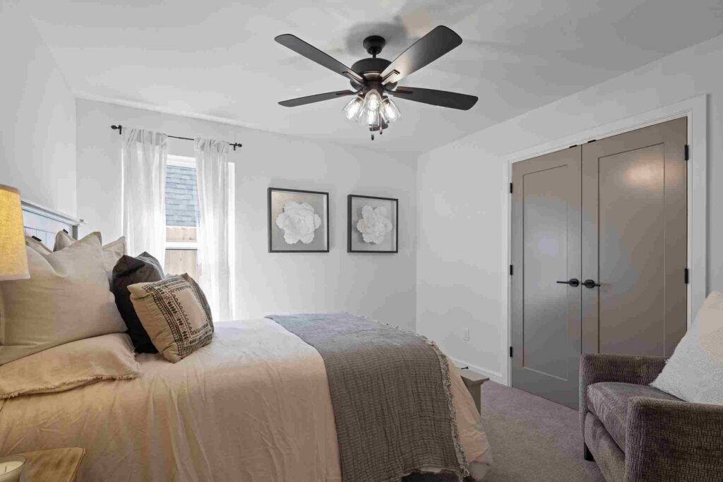 A hallway featuring white walls and hardwood floors, located in Oklahoma City