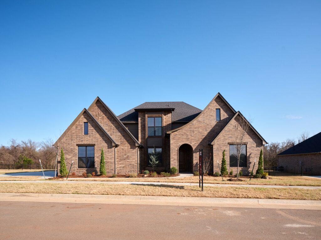 Large brick house with gabled roof & Luke floor plan in the Oklahoma City metro area.