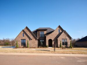 Large brick house with gabled roof & Luke floor plan in the Oklahoma City metro area.