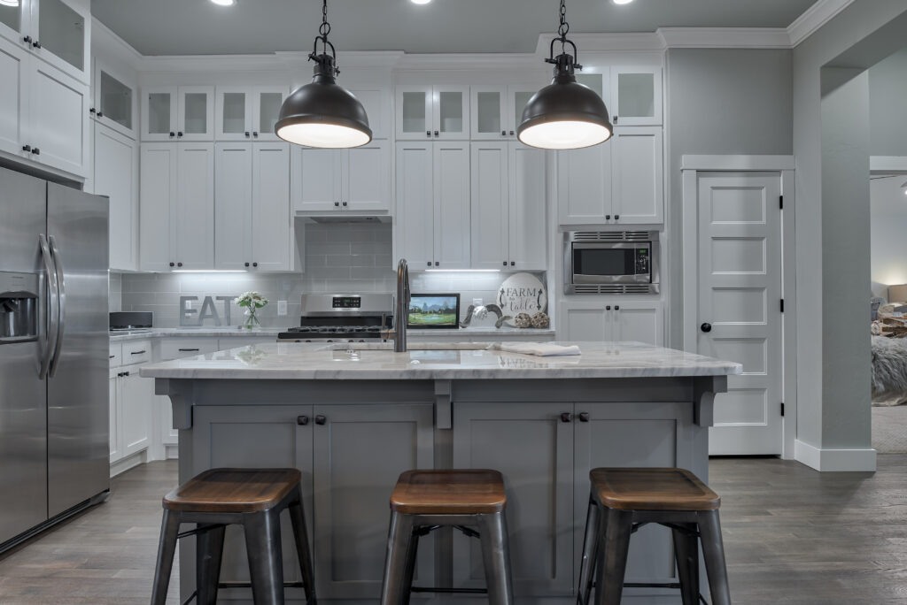 Stylish kitchen designs with white cabinetry and pendant lighting in Oklahoma City