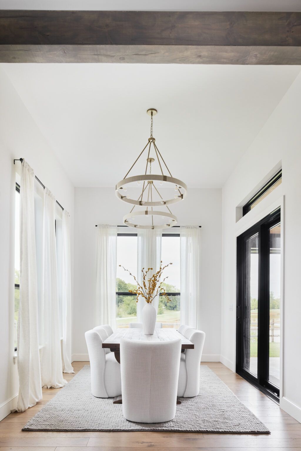 Elegant dining room with white chairs from our Gallery of Beautiful Homes in Oklahoma City