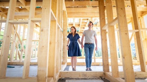 A couple walking through their house under construction during a site visit in Oklahoma City