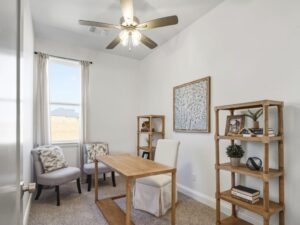 Home office with desk, chairs, and shelving in Oklahoma City metro area residence
