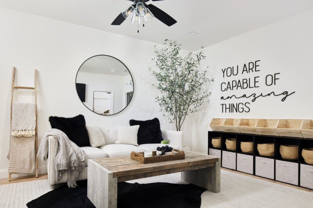 Styled living room with sofa, coffee table, and wall art in Oklahoma City metro area home